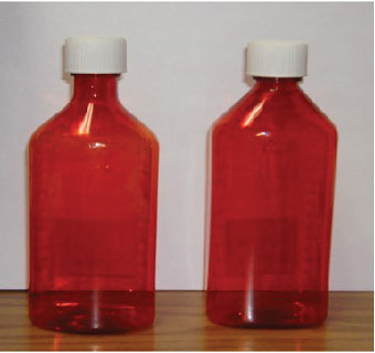 GRADUATED OVAL BOTTLE WITH RESISTANT CAP AMBER PLASTIC 2 OZ 50/BX